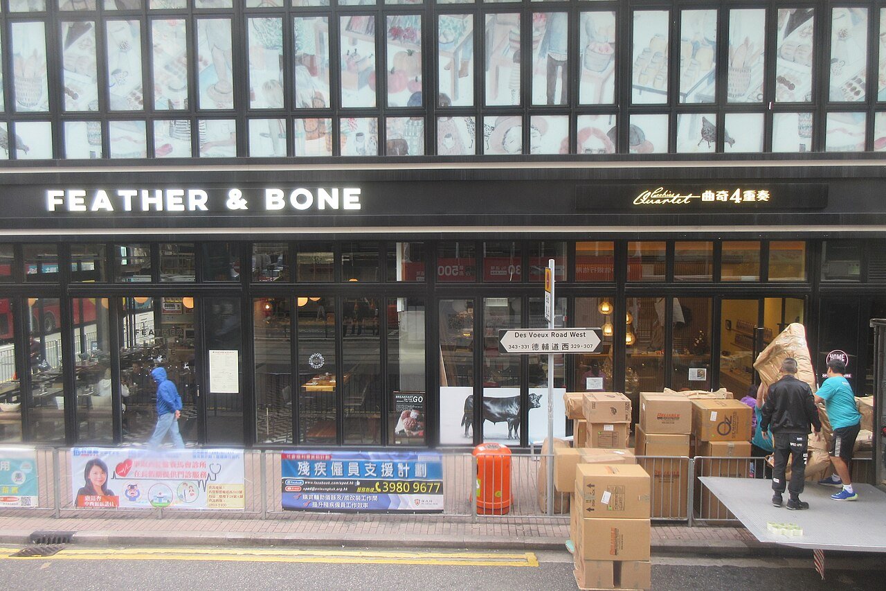 Feather & Bone Sai Ying Pun storefront on Des Voeux Road West, photographed in December 2018